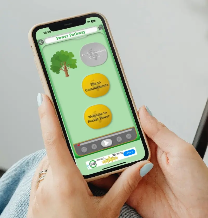 Man and woman walking along a bright pathway under blue skies with the Pocket Power app screenshot showing the Power Pathway feature, symbolising a guided journey to wellness