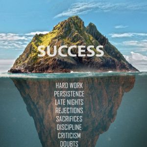 A tall mountain standing tall out of the water with all the work it took to grow to that success hidden out of sight under the waterline.